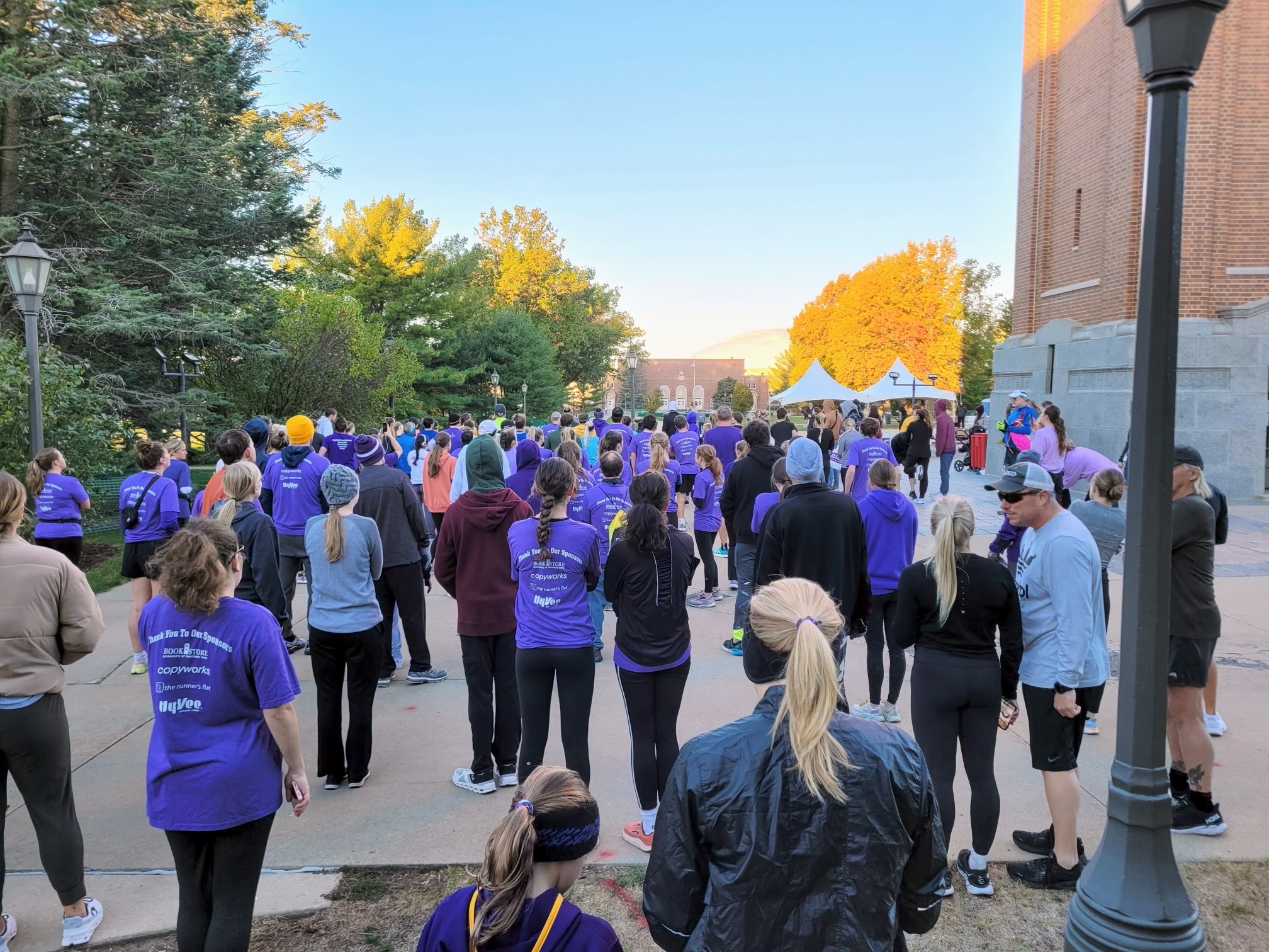 Runners standing in the Campanile Plaza Prior to the start of the 5K event